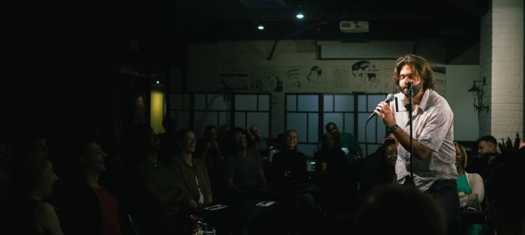 interior of a montreal comedy club with stage and seating
