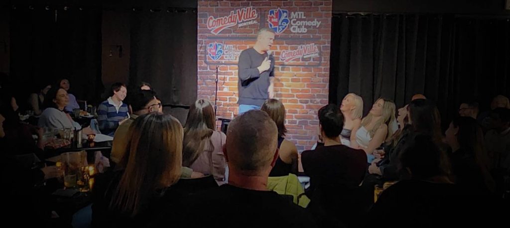 open mic comedy night in montreal performer on stage